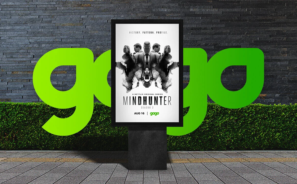 GAGO logo wall and a Mindhunter poster for Green Apple Entertainment