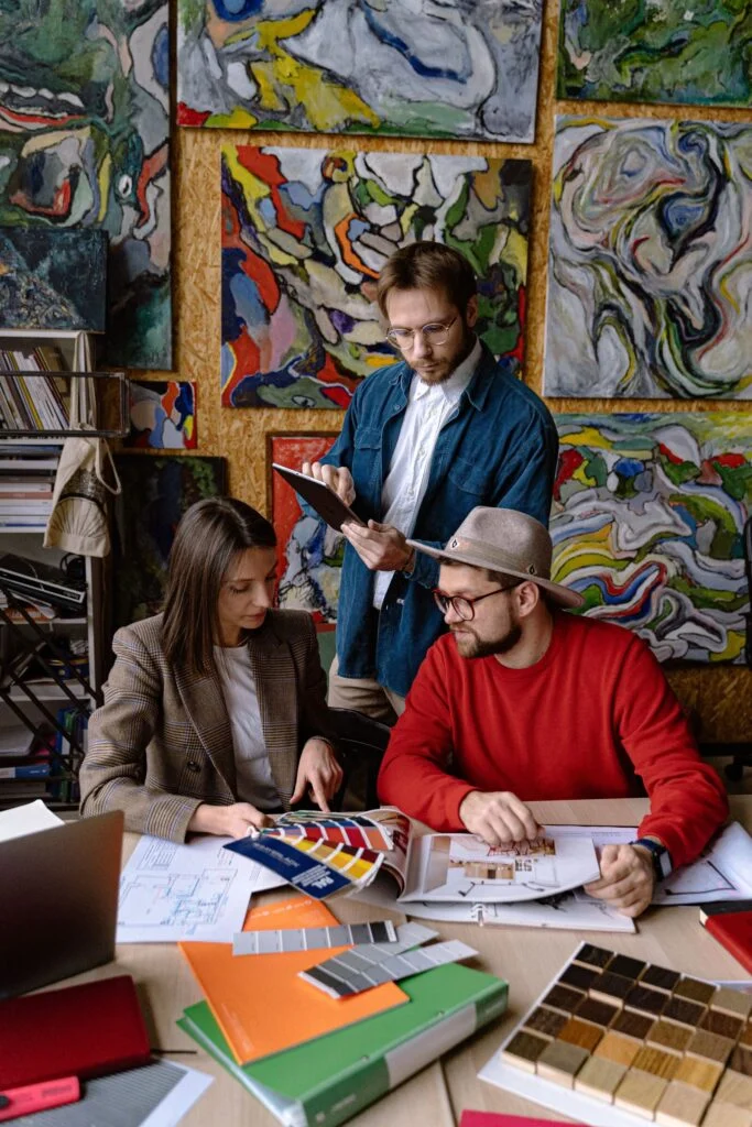 A creative team reviewing color swatches and sketches around a table